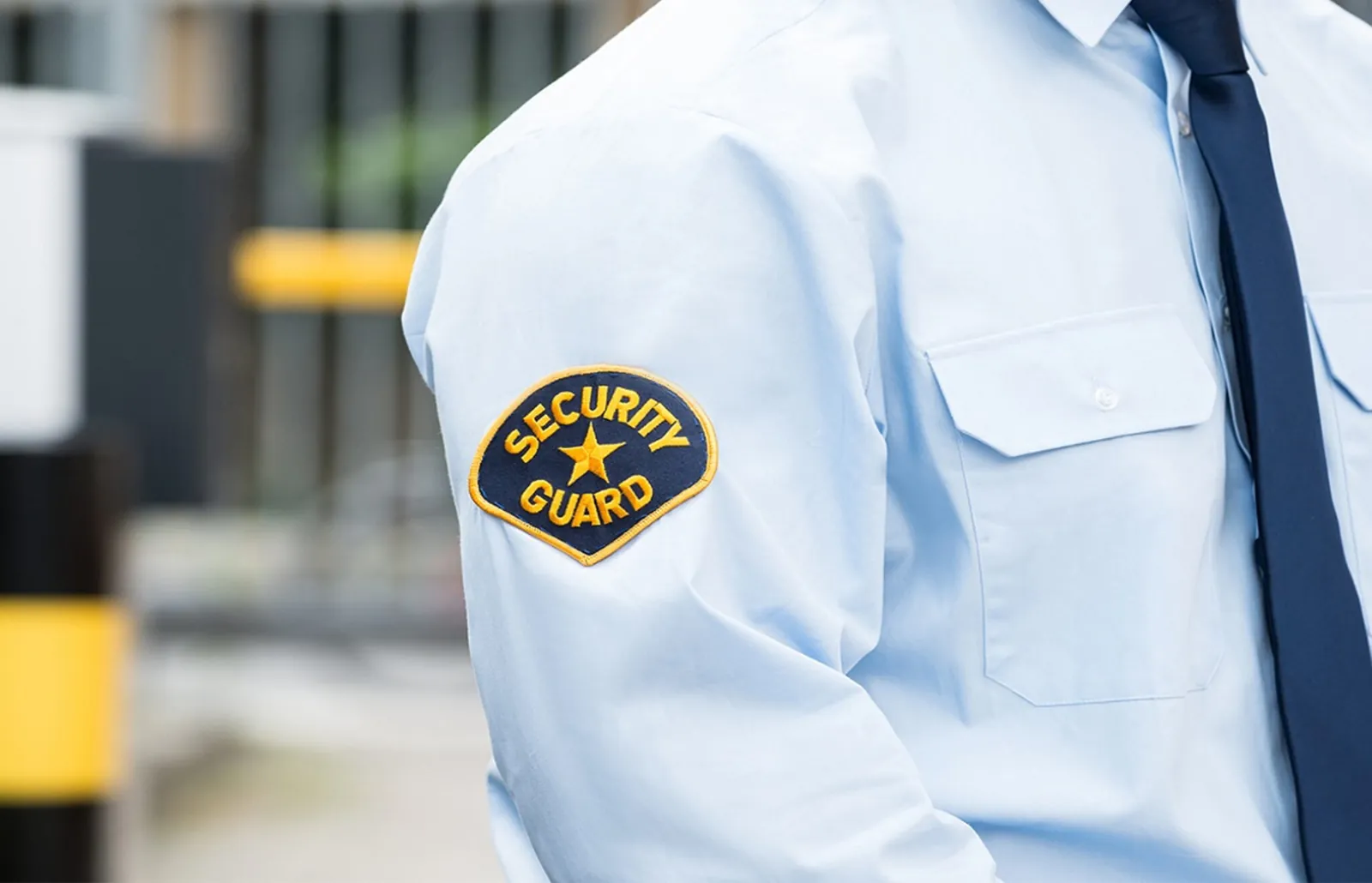 Close-up of a security guard uniform sleeve with a Security Guard patch